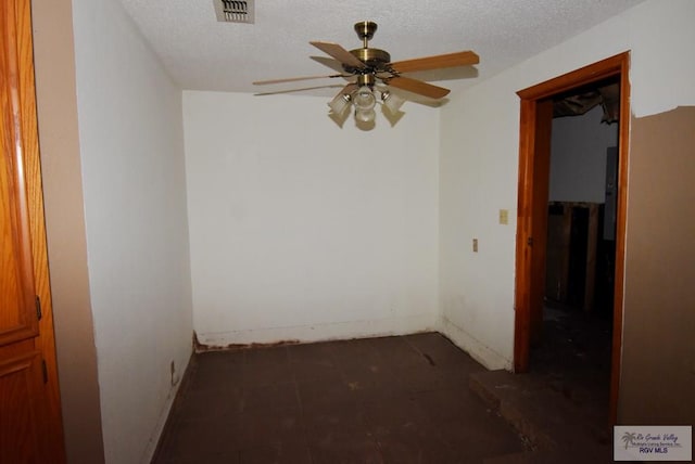 195 W 3rd St, Sebastian, TX 78594 - empty room featuring a ceiling fan, baseboards, and a textured ceiling