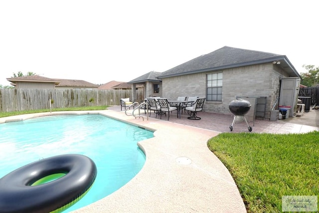 448 Rey Juan Carlos St, Brownsville, TX 78521 - view of swimming pool featuring grilling area, a patio area, and a fenced backyard