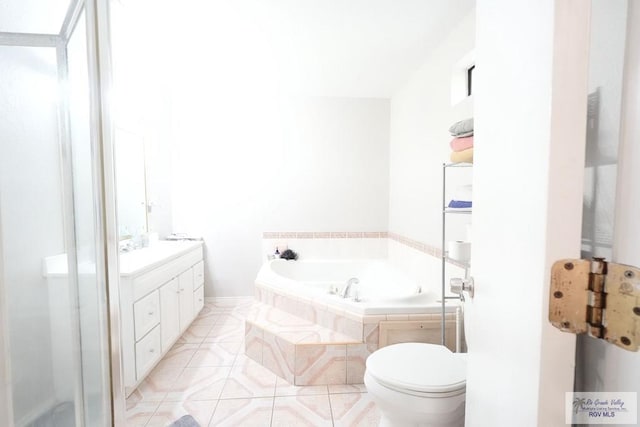 448 Rey Juan Carlos St, Brownsville, TX 78521 - bathroom with a bath, toilet, vanity, tile patterned floors, and a shower with shower door