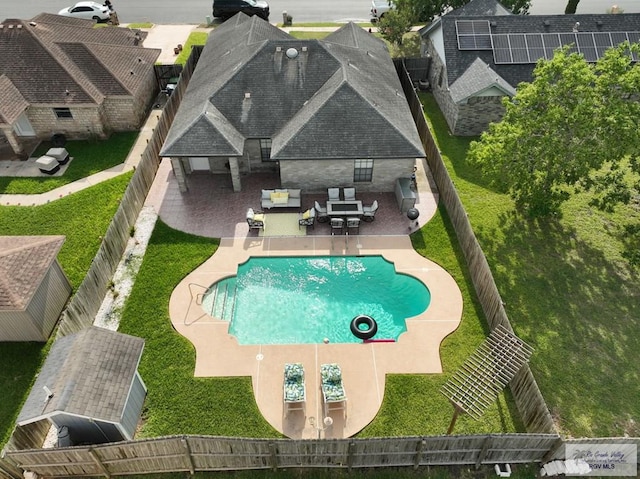 448 Rey Juan Carlos St, Brownsville, TX 78521 - view of pool featuring an outdoor living space, a fenced backyard, and a patio
