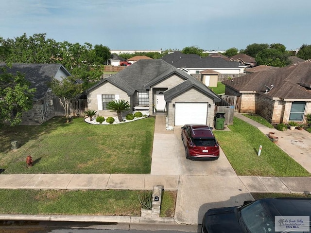 448 Rey Juan Carlos St, Brownsville, TX 78521 - view of front of house with concrete driveway, a front yard, an attached garage, and a residential view
