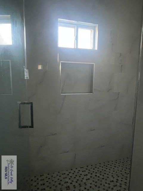 9206 Empress Ln, Harlingen, TX 78552 - full bath with a stall shower and healthy amount of natural light