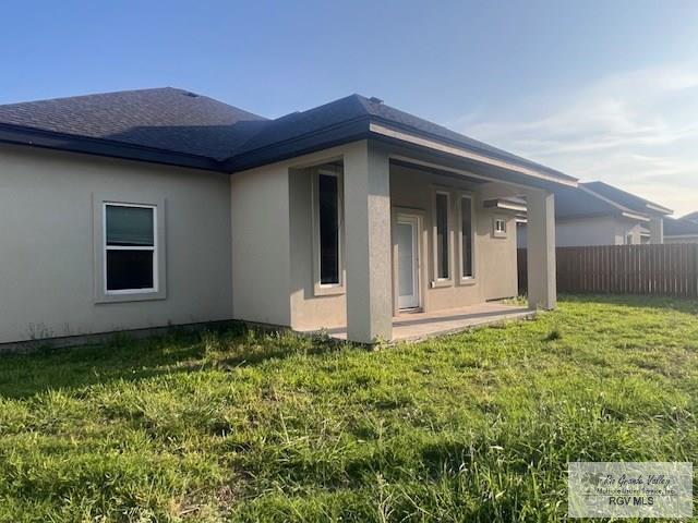 9206 Empress Ln, Harlingen, TX 78552 - view of side of home with stucco siding
