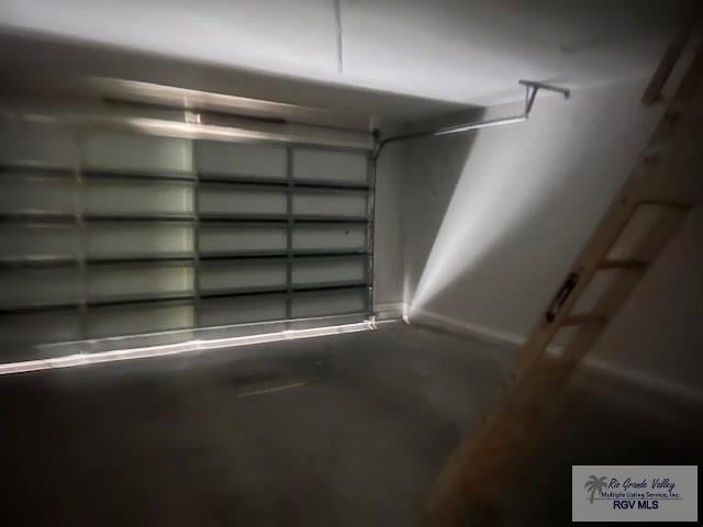 9206 Empress Ln, Harlingen, TX 78552 - garage with baseboards