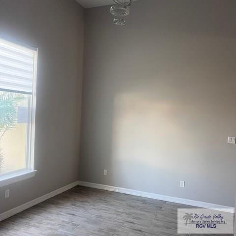 9206 Empress Ln, Harlingen, TX 78552 - unfurnished room featuring wood finished floors and baseboards