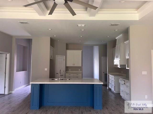9206 Empress Ln, Harlingen, TX 78552 - kitchen featuring a sink, dark wood finished floors, ceiling fan, white cabinets, and beamed ceiling