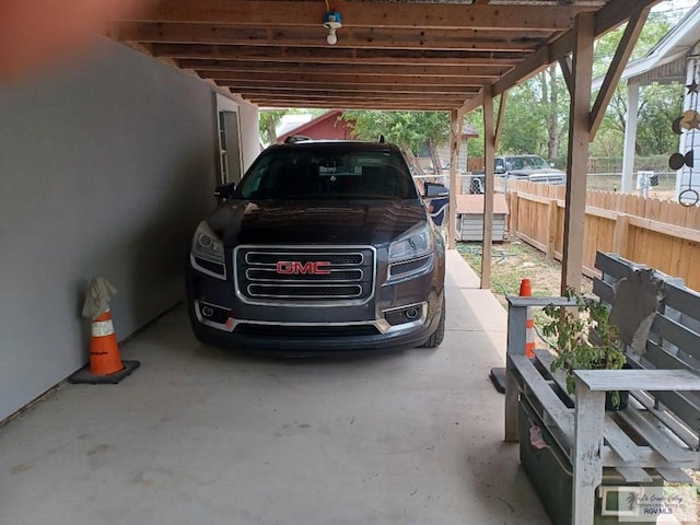 view of vehicle parking with a carport