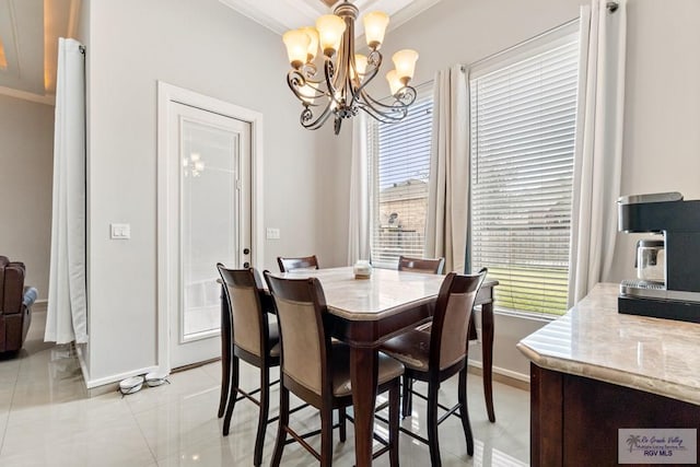 tiled dining space with crown molding and a notable chandelier