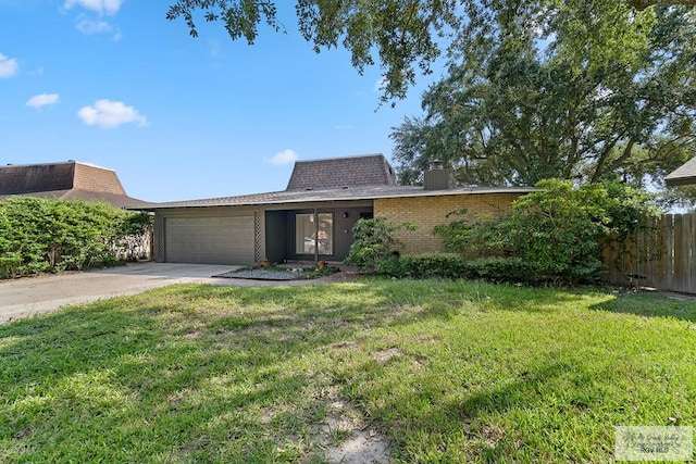 single story home with a garage and a front lawn