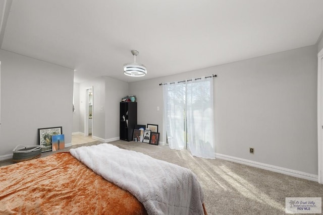 bedroom with light colored carpet