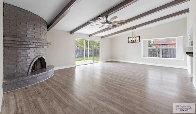 45 Varadero St, Brownsville, TX 78526 - unfurnished living room featuring a ceiling fan, a fireplace, baseboards, and wood finished floors
