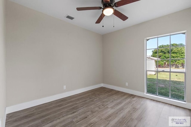 45 Varadero St, Brownsville, TX 78526 - unfurnished room featuring wood finished floors, ceiling fan, and baseboards