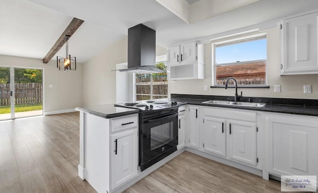 45 Varadero St, Brownsville, TX 78526 - kitchen with black / electric stove, island exhaust hood, a sink, dark countertops, and a peninsula