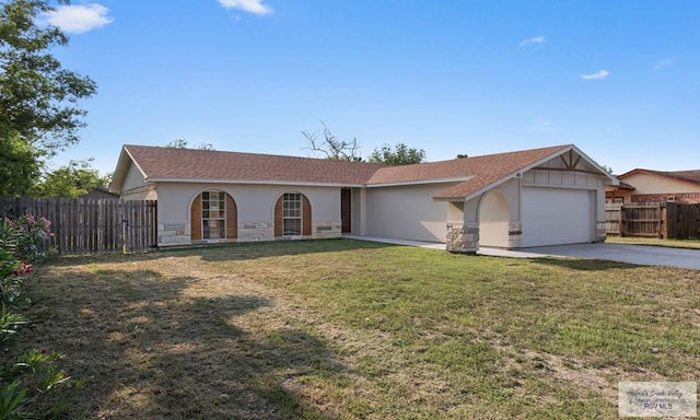 45 Varadero St, Brownsville, TX 78526 - single story home featuring an attached garage, driveway, stucco siding, and stone siding