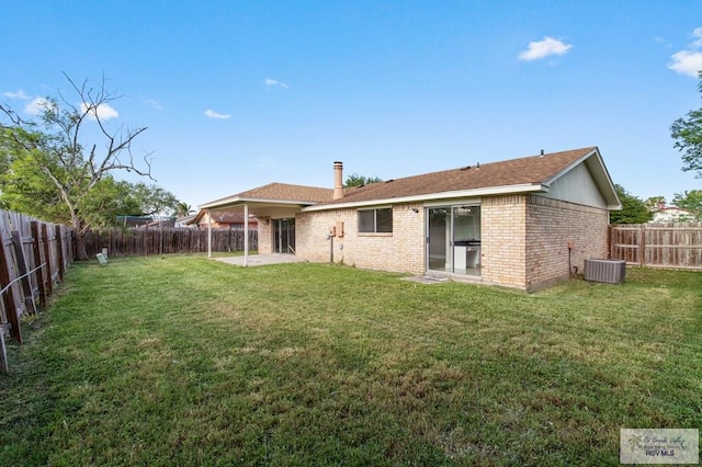 45 Varadero St, Brownsville, TX 78526 - rear view of property featuring cooling unit, a patio area, and brick siding