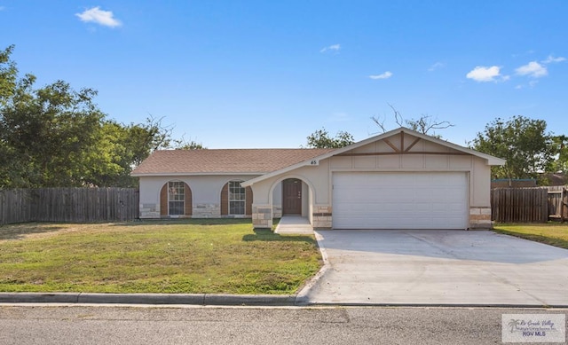 45 Varadero St, Brownsville, TX 78526 - single story home with concrete driveway, an attached garage, stucco siding, and stone siding