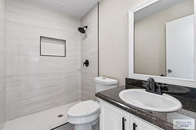 45 Varadero St, Brownsville, TX 78526 - full bath with toilet, vanity, and a tile shower