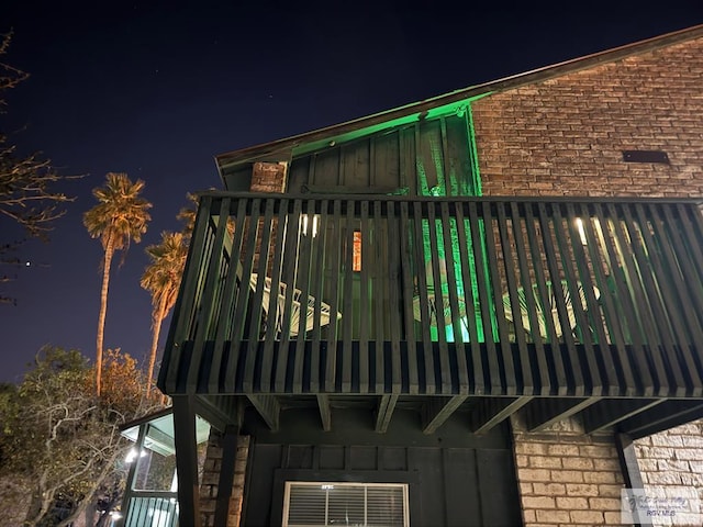 exterior space with board and batten siding and brick siding