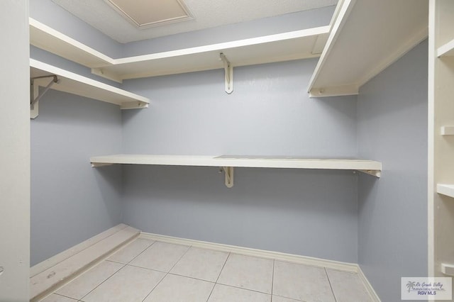 3100 Umar Ave, Mcallen, TX 78504 - walk in closet with light tile patterned floors
