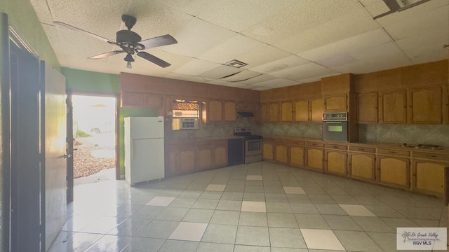 kitchen featuring a paneled ceiling, ceiling fan, white appliances, and light tile patterned floors