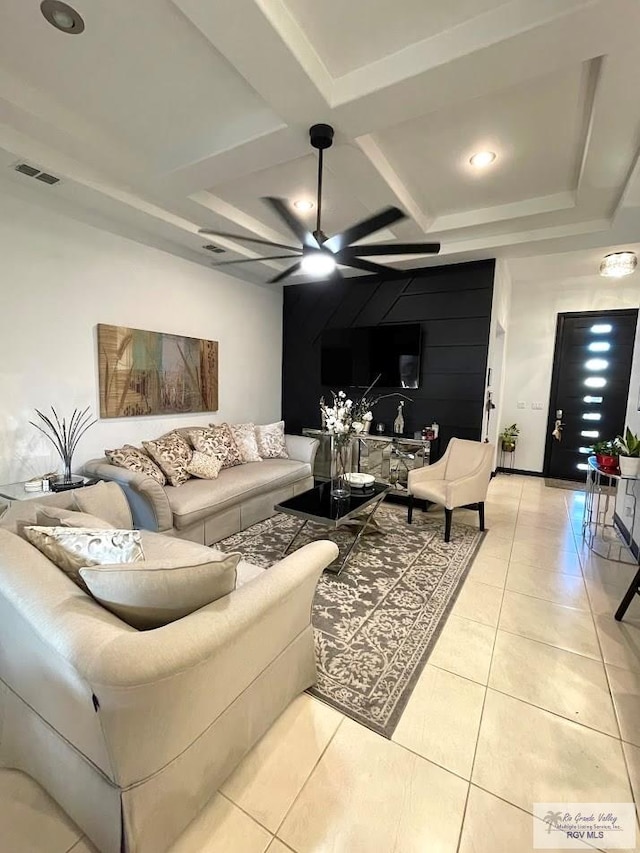 tiled living room featuring ceiling fan and coffered ceiling