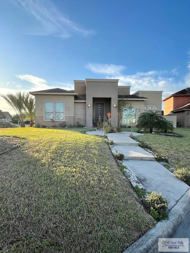 view of front of property with a front lawn