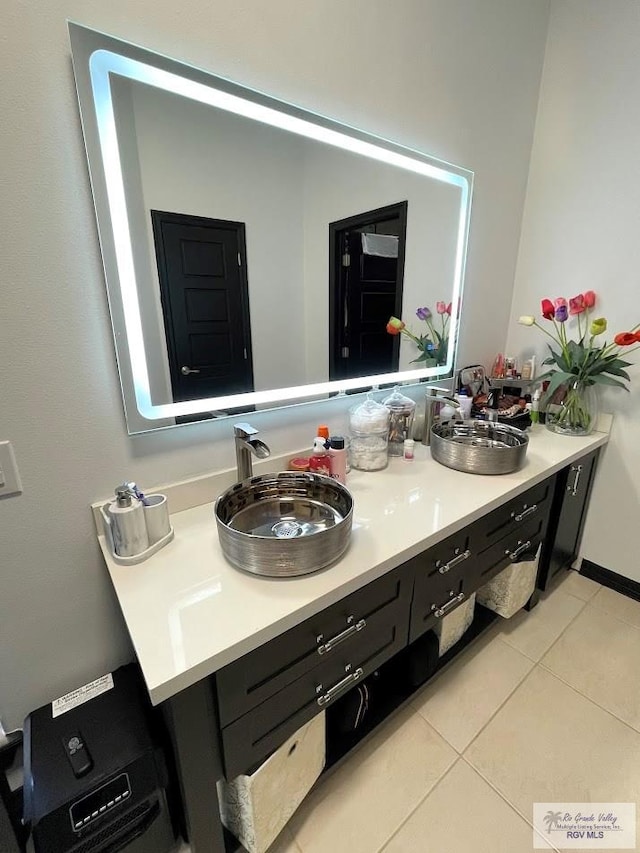 bathroom with tile patterned flooring and vanity