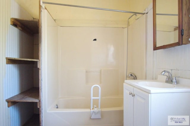 bathroom featuring shower / tub combination and vanity