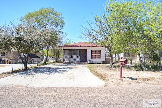 view of front of house featuring fence