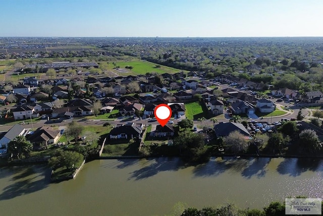 drone / aerial view with a residential view and a water view