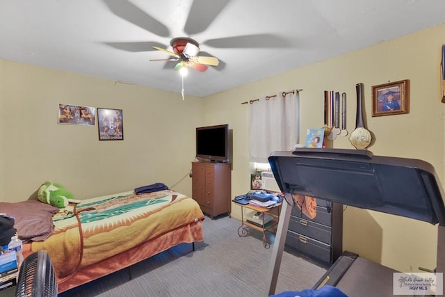 carpeted bedroom with a ceiling fan