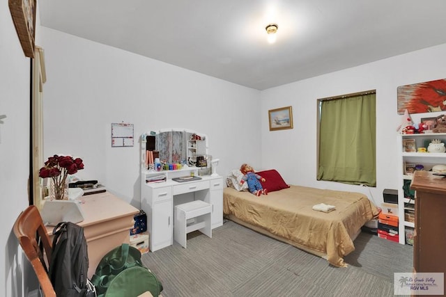 bedroom featuring light carpet