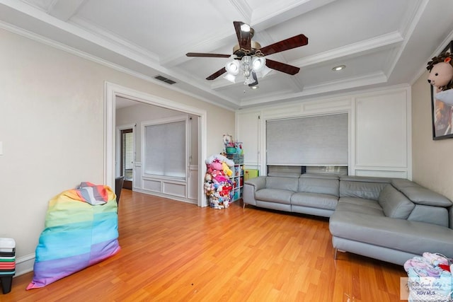 134 Camaguey Ave, Brownsville, TX 78526 - living room with ceiling fan, coffered ceiling, beam ceiling, light wood-style flooring, and crown molding