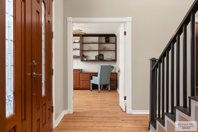 3406 Spyglass Hill Dr, Harlingen, TX 78550 - entrance foyer with baseboards, light wood finished floors, and stairway