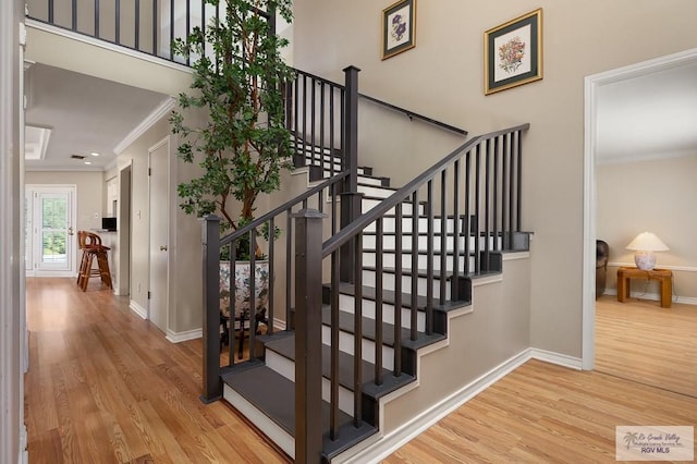 3406 Spyglass Hill Dr, Harlingen, TX 78550 - stairs featuring wood finished floors, ornamental molding, and baseboards