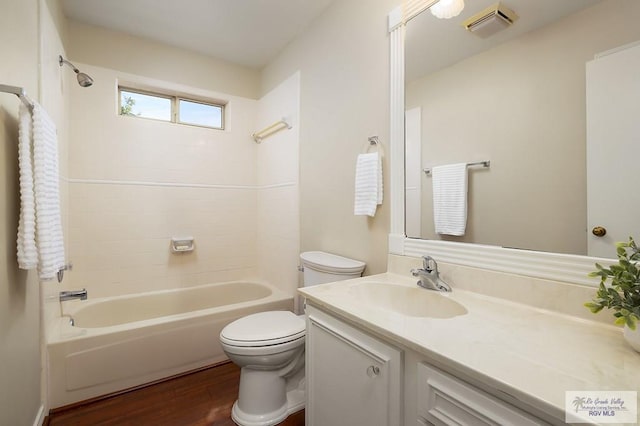 3406 Spyglass Hill Dr, Harlingen, TX 78550 - full bath featuring vanity, toilet, shower / bathtub combination, and wood finished floors