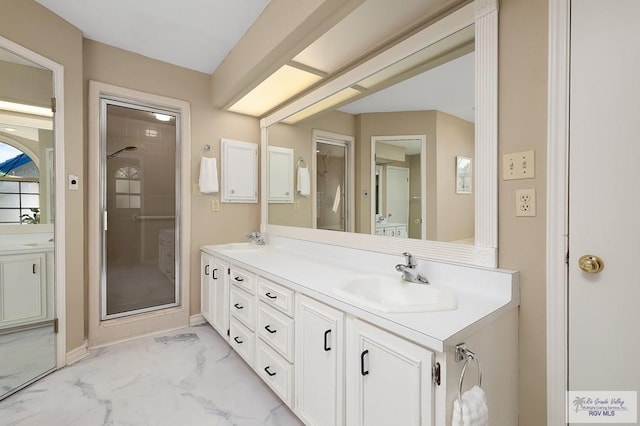3406 Spyglass Hill Dr, Harlingen, TX 78550 - full bathroom with marble finish flooring, double vanity, and a stall shower