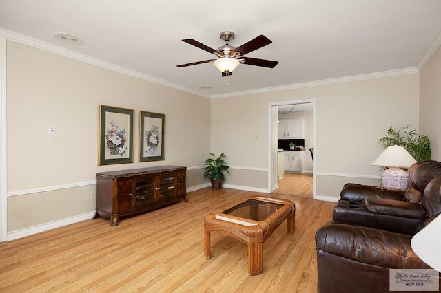 3406 Spyglass Hill Dr, Harlingen, TX 78550 - living area with ornamental molding, wood finished floors, a ceiling fan, and baseboards