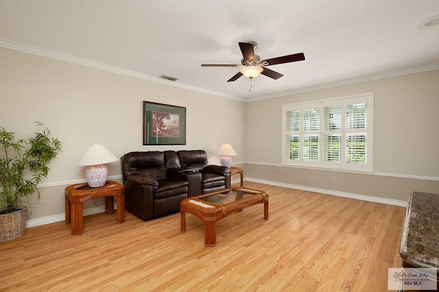 3406 Spyglass Hill Dr, Harlingen, TX 78550 - living room with light wood-style floors, a ceiling fan, ornamental molding, and baseboards