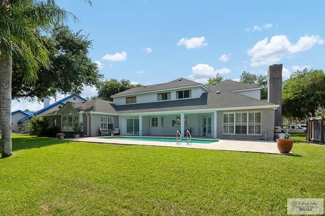 3406 Spyglass Hill Dr, Harlingen, TX 78550 - rear view of house featuring a patio and a chimney