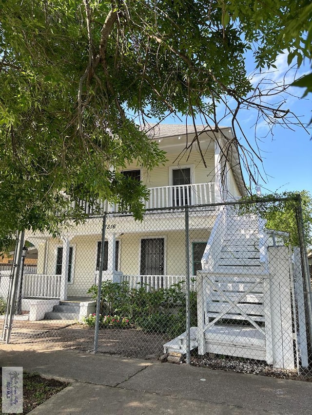 view of front facade with a balcony