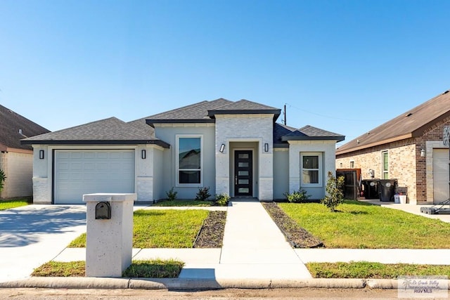 view of front of home featuring a garage and a front yard