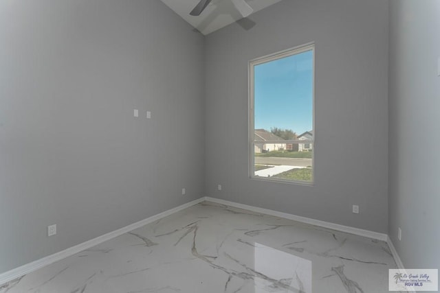 unfurnished room featuring ceiling fan and vaulted ceiling