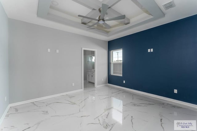 unfurnished bedroom featuring connected bathroom, a tray ceiling, ceiling fan, and coffered ceiling