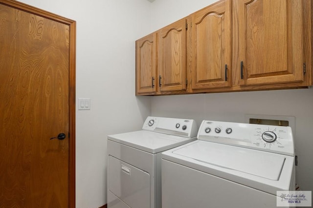 laundry area featuring cabinet space and washer and dryer