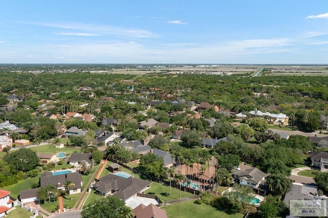 birds eye view of property with a residential view