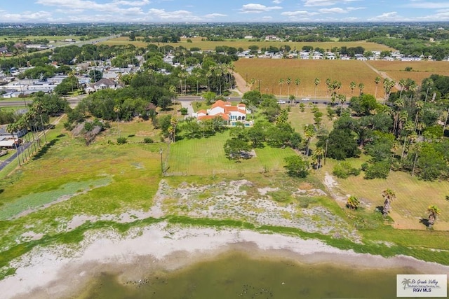 drone / aerial view with a rural view and a water view