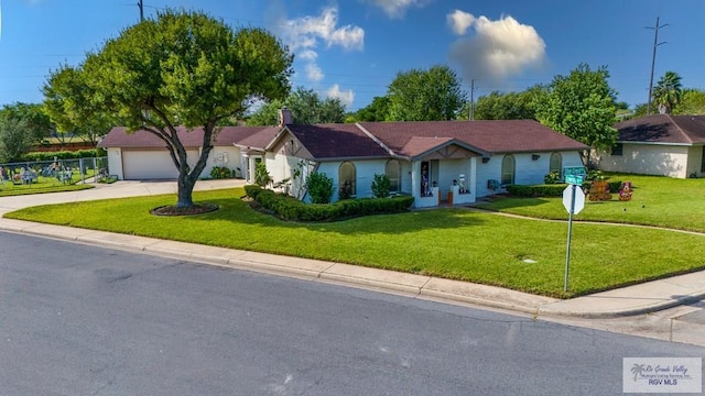 single story home with a front lawn