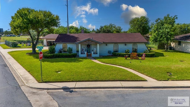 single story home with a front lawn