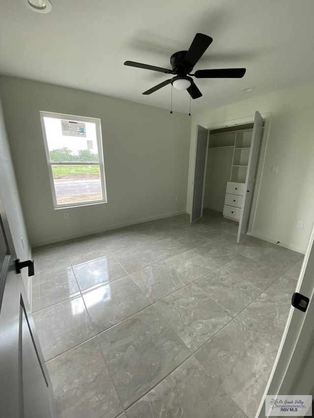 unfurnished bedroom featuring a closet and ceiling fan